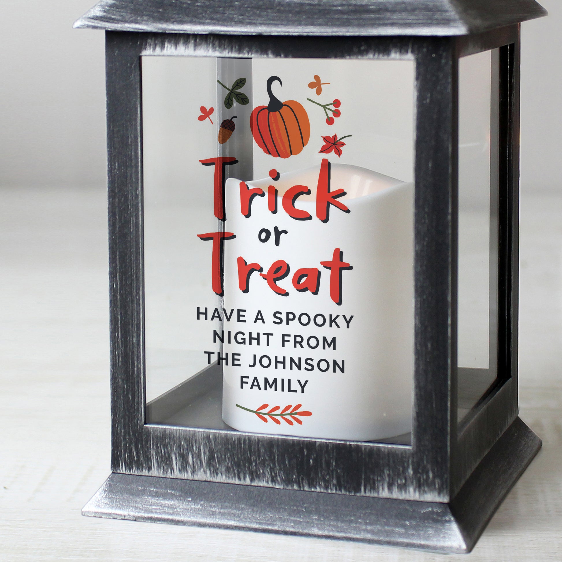 Black lantern with 'Trick or Treat' message and personalised text on a white background