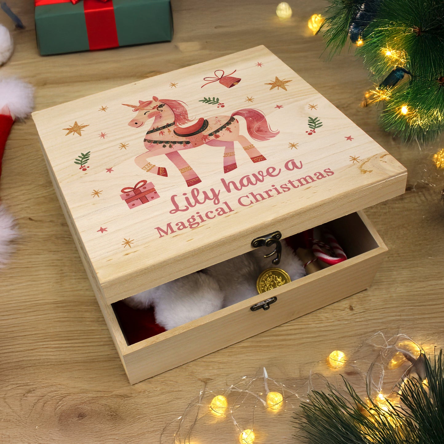 Wooden personalised unicorn image Christmas Eve box. Text reads Lily have a Magical Christmas in red.