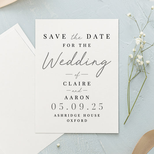 Wedding save the date card with envelope and flowers on a light blue background