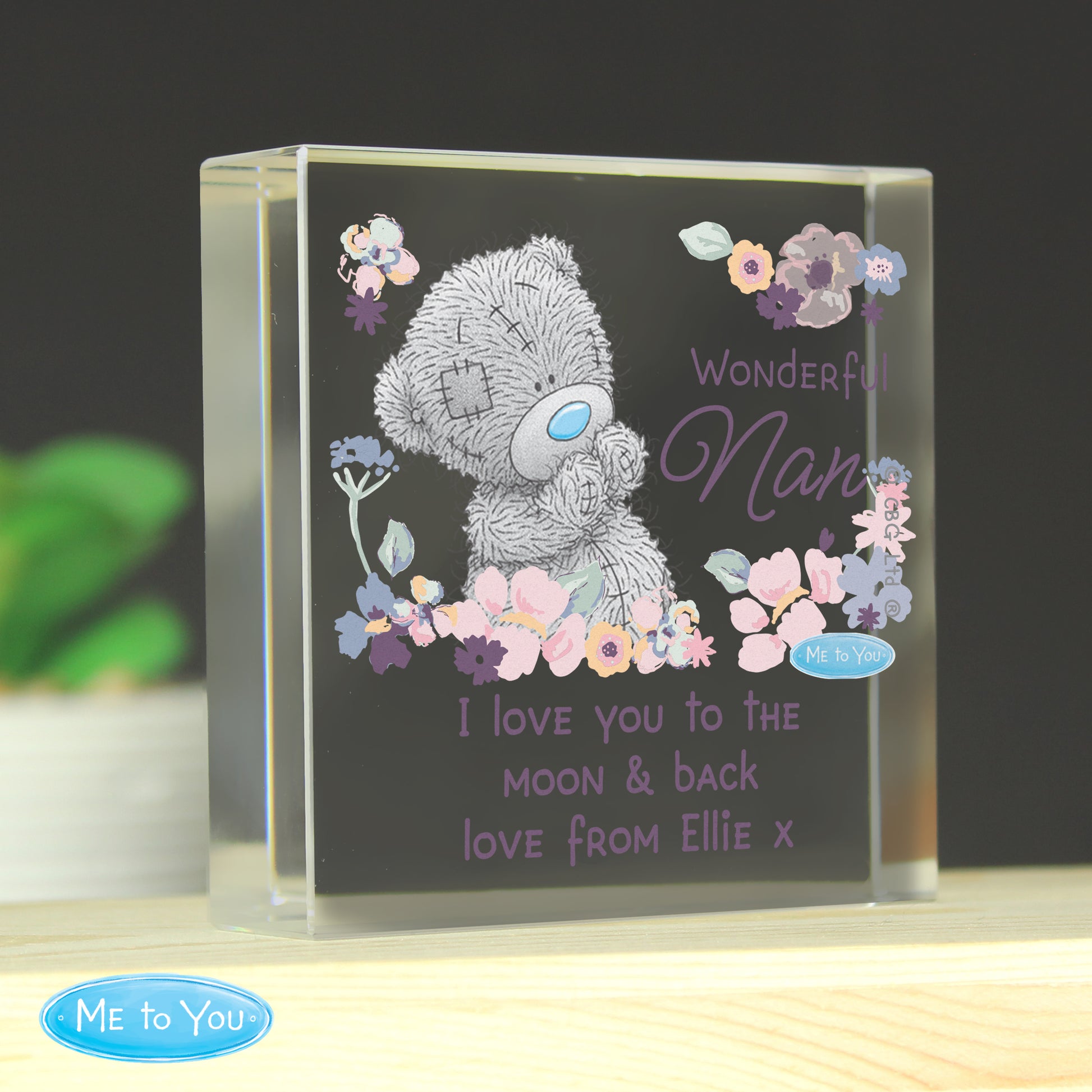 Personalised glass block with a teddy bear and floral design, featuring the text 'Wonderful Nan I love you to the moon & back love from Ellie x'.