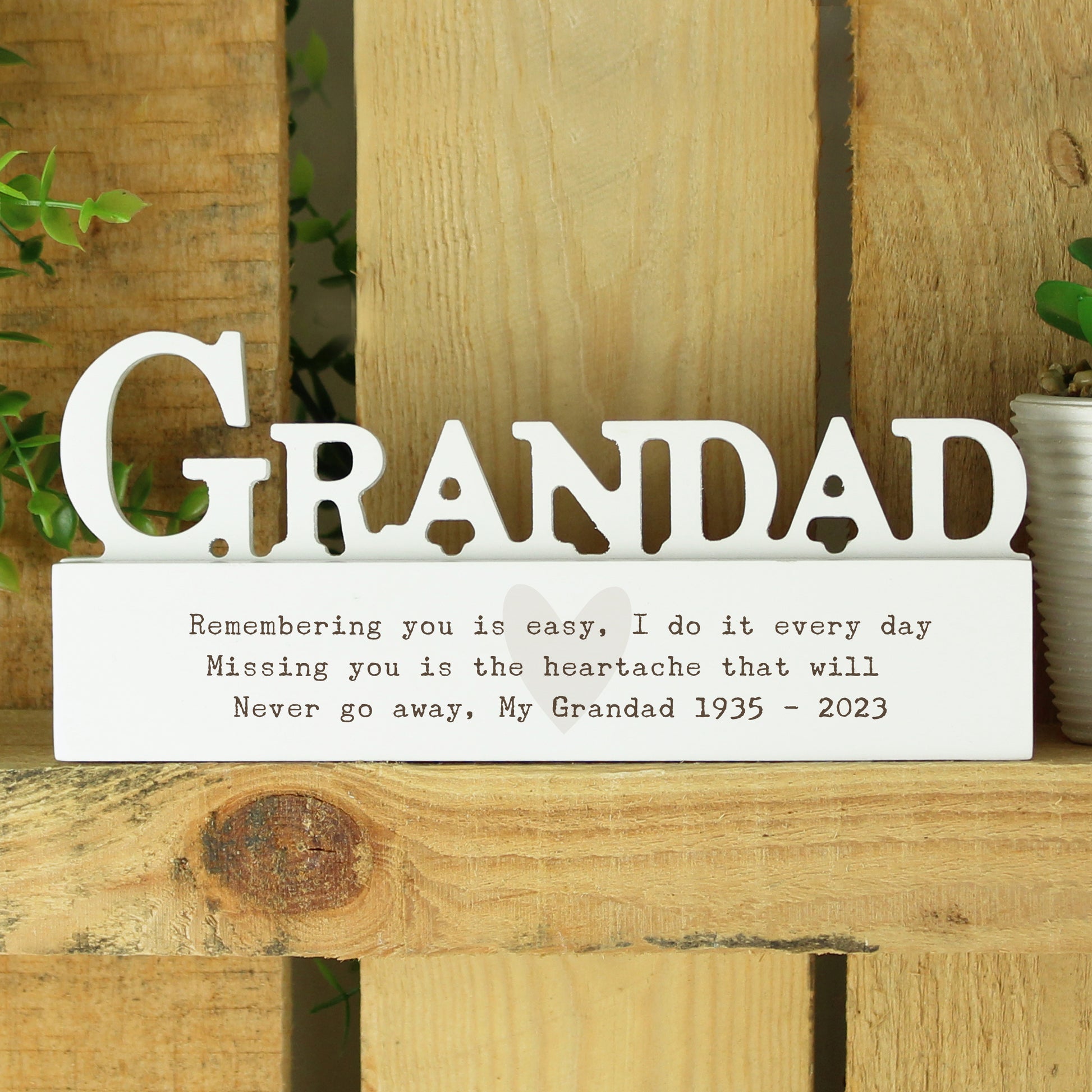 Memorial sign for Grandad with text on a wooden background