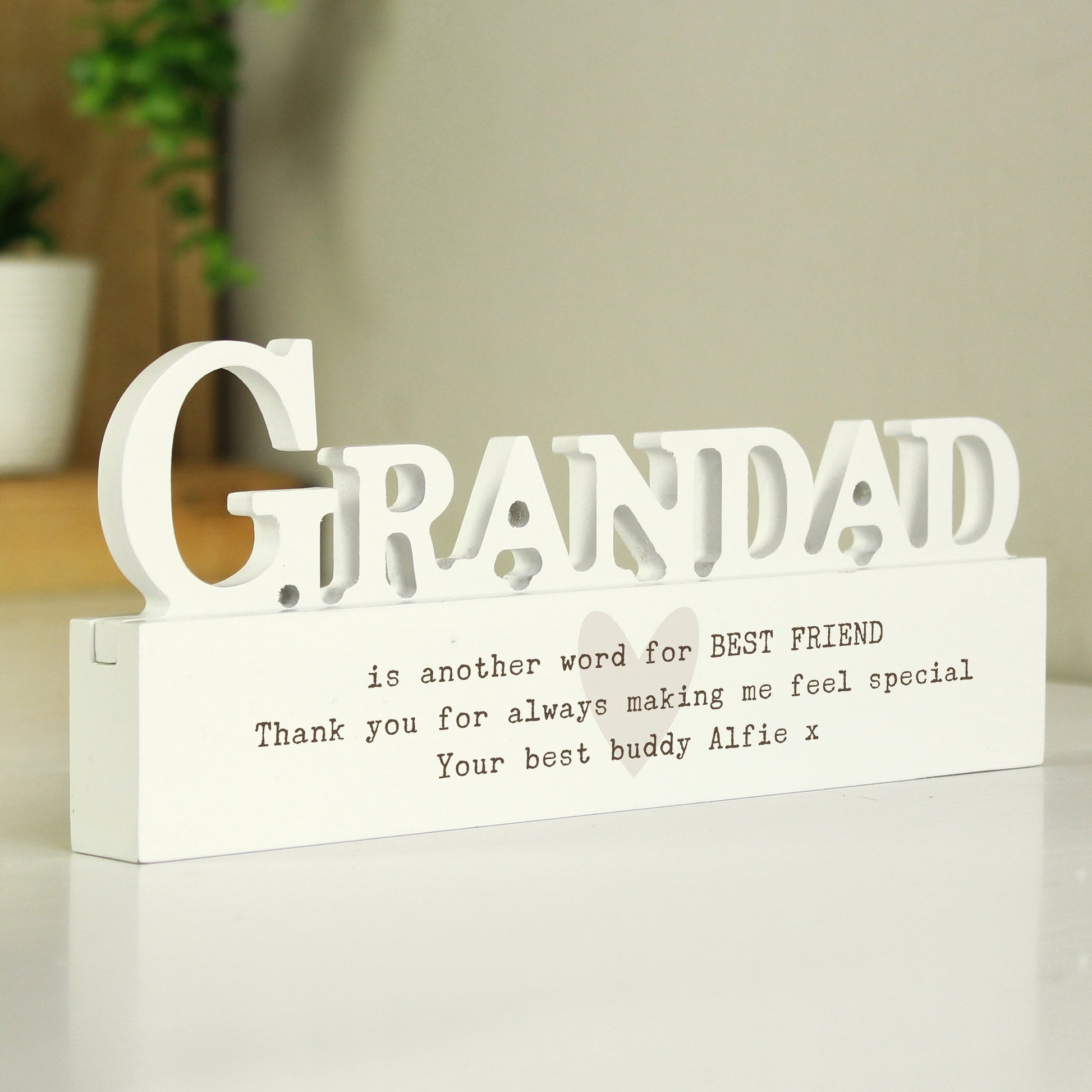 White wooden sign with 'GRANDAD' and a message on a light background