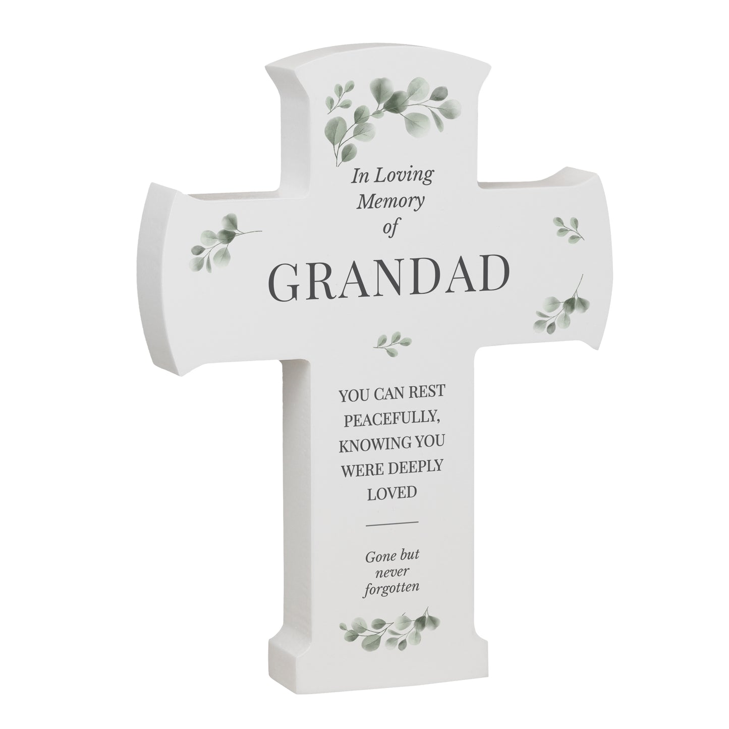 White cross-shaped memorial plaque with engraved text and greenery on a white background