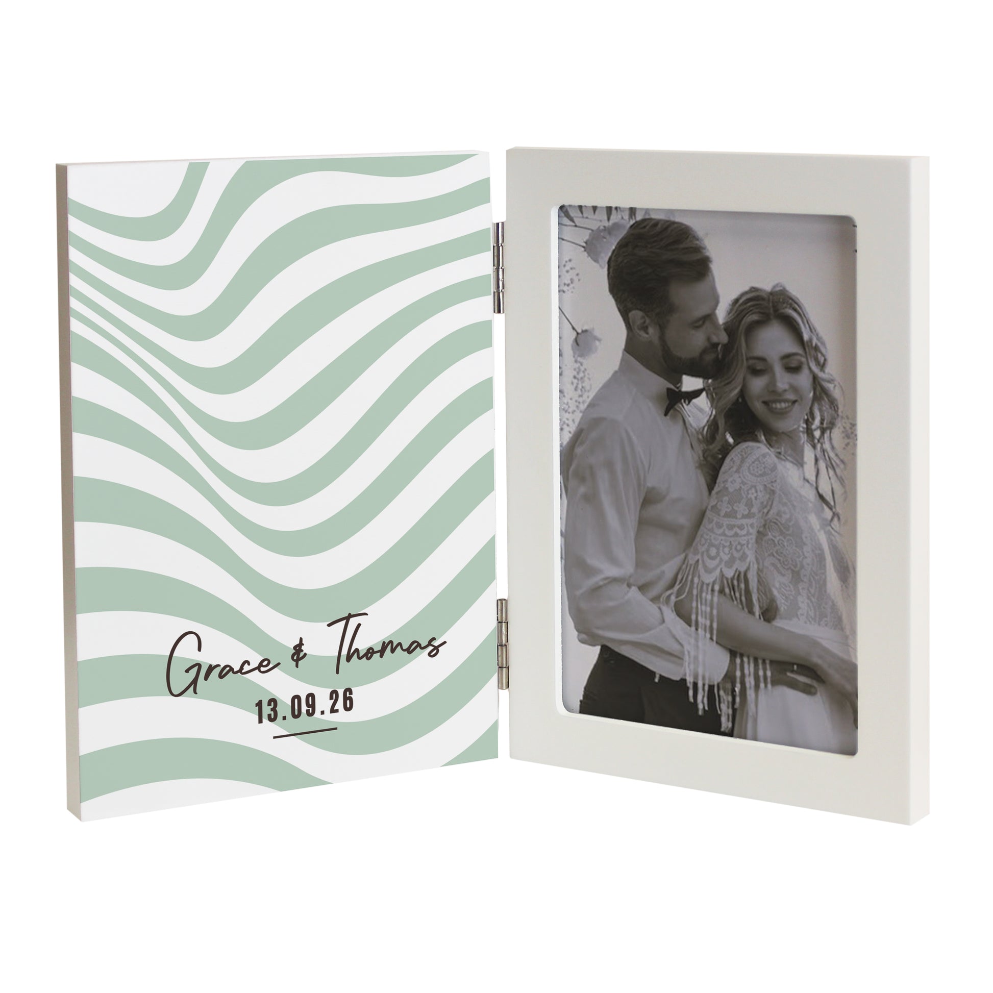 Hinged photo frame with wavy design on one side and a couple on the other