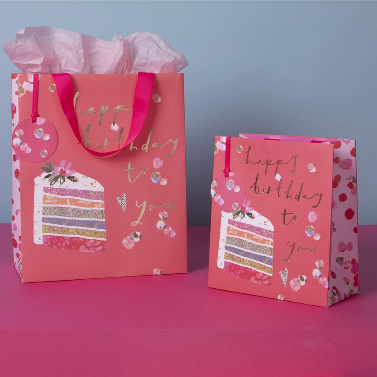 Lifestyle image with large and medium matching bags and tissue paper