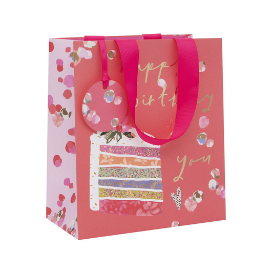 Coral colour gift bag with rainbow cake and gold foil text