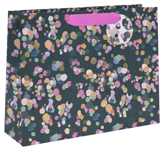 landscape gift bag with navy/black background and pink, purple, gold and mint green dots