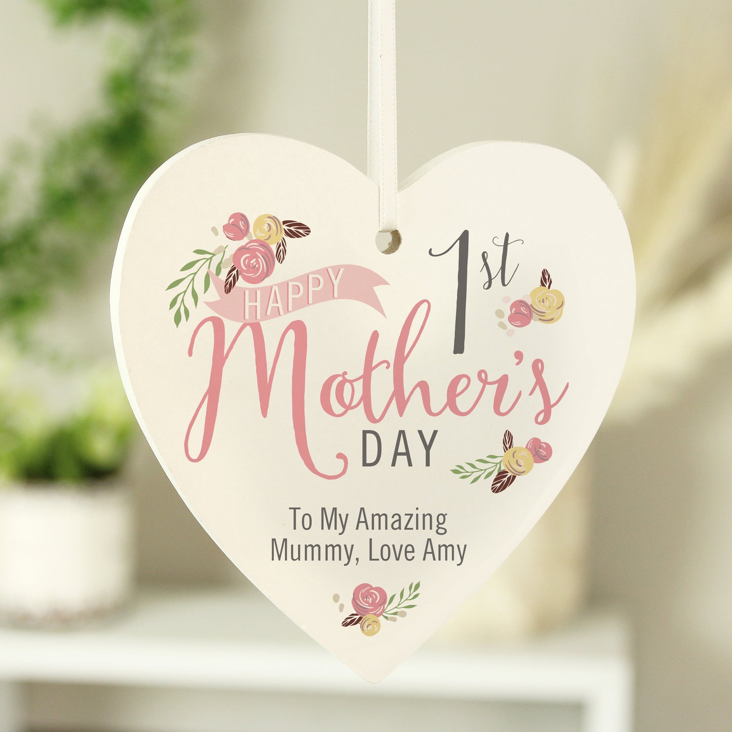 Personalised 1st Mother's Day Hanging Heart Decoration shown hanging up.