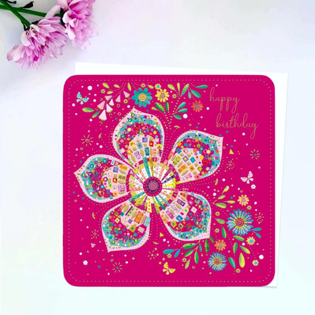 Bright pink card with large mosaic style flower in multicolour print. 