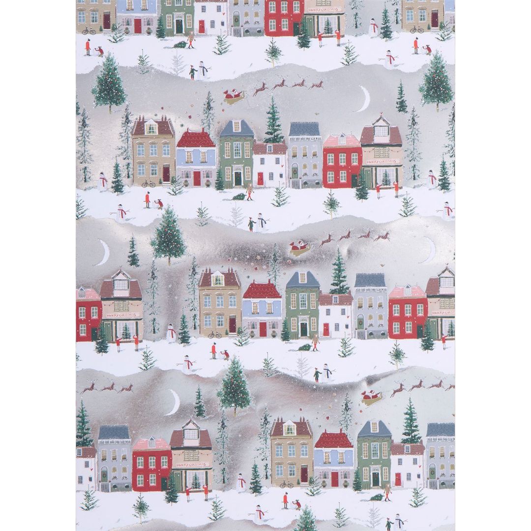 White paper with snow covered houses and people playing in snow