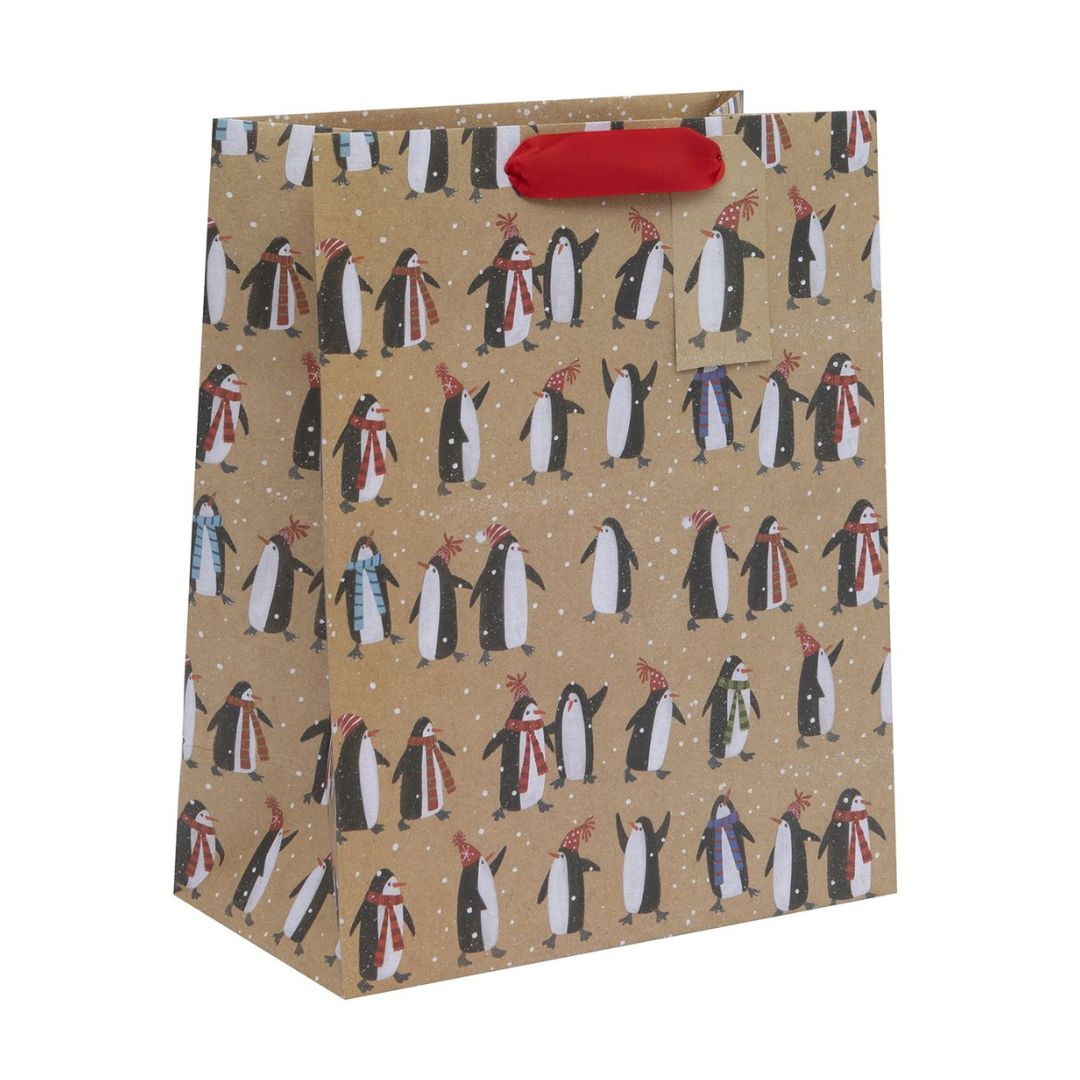 Kraft bag with penguins in scarves and hats with red ribbon handle