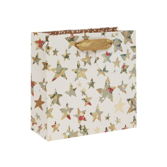 Cream bag with gold green and red stars with gold ribbon handles