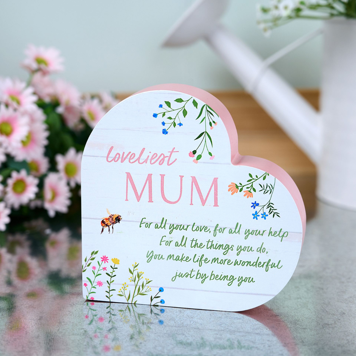 Lifestyle image showing heart shaped plaque on display