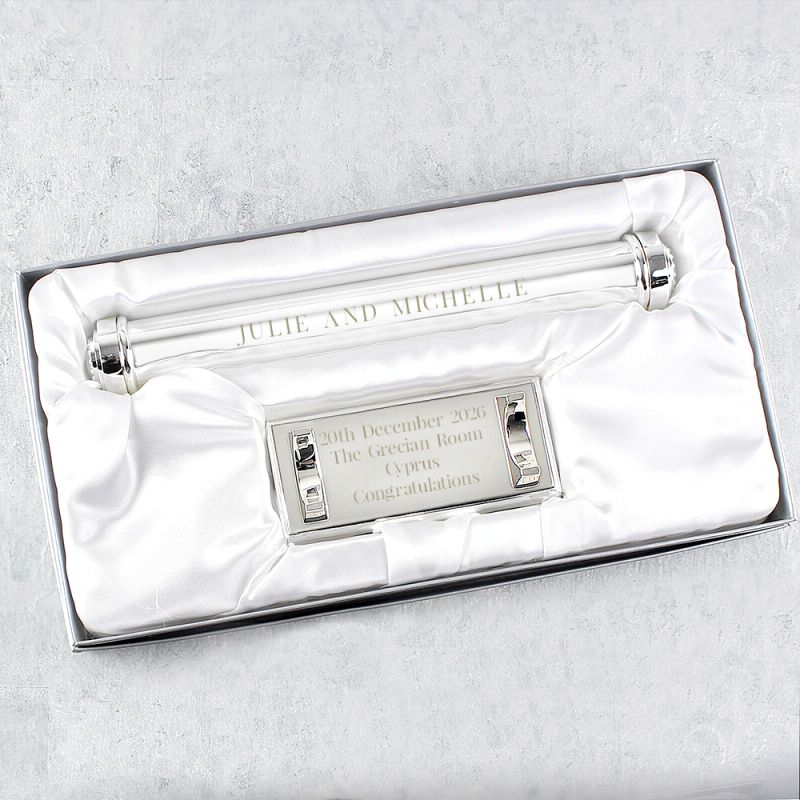 Silver certificate holder with engraved text in a white box on a light grey background