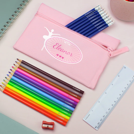 Pink pencil case with personalised name, colourful pencils, ruler, and sharpener on a light background