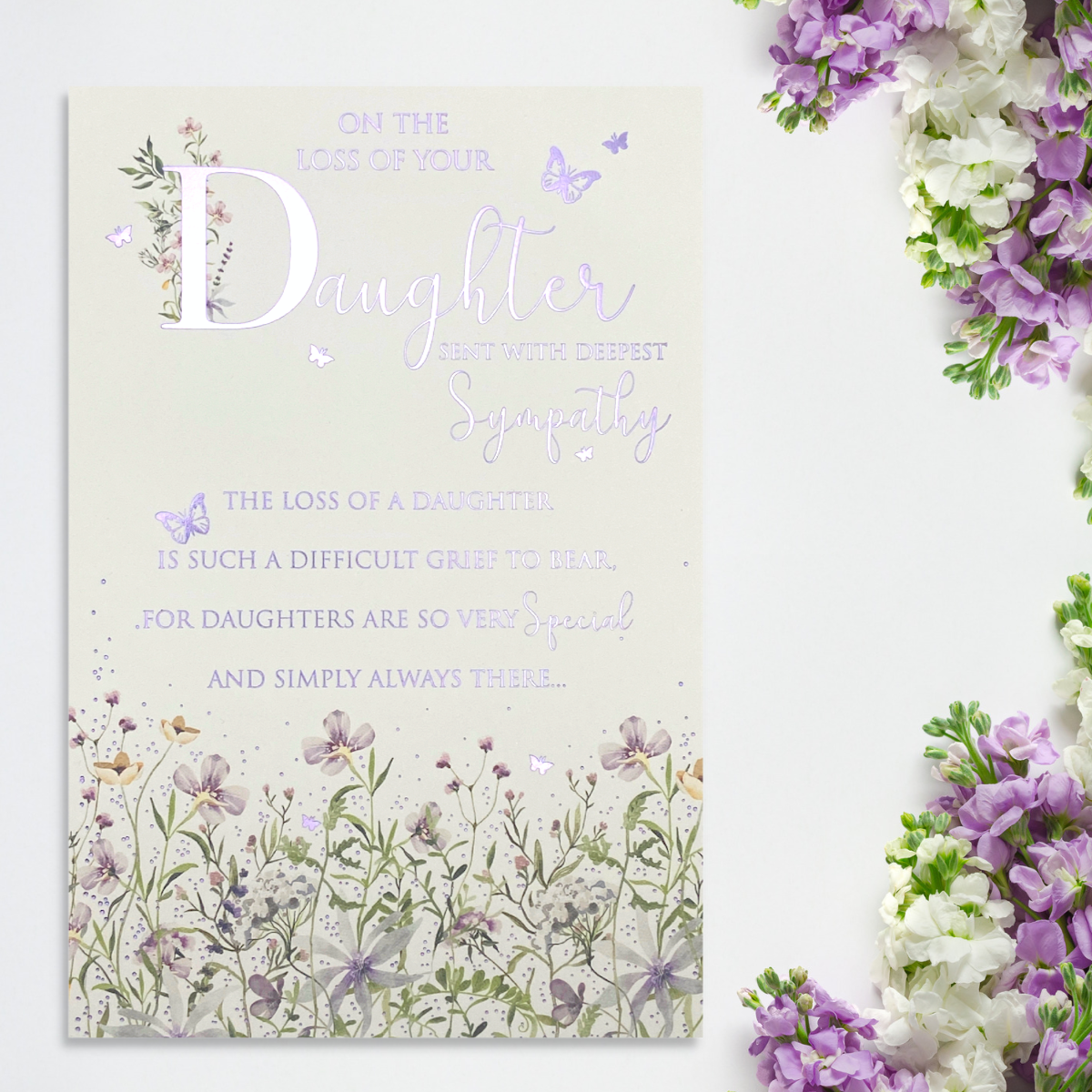 front image showing lilac foiled text and wild flower border with butterflies