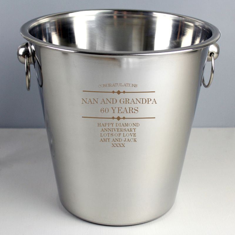 Stainless steel ice bucket shown with personalised message on shelf