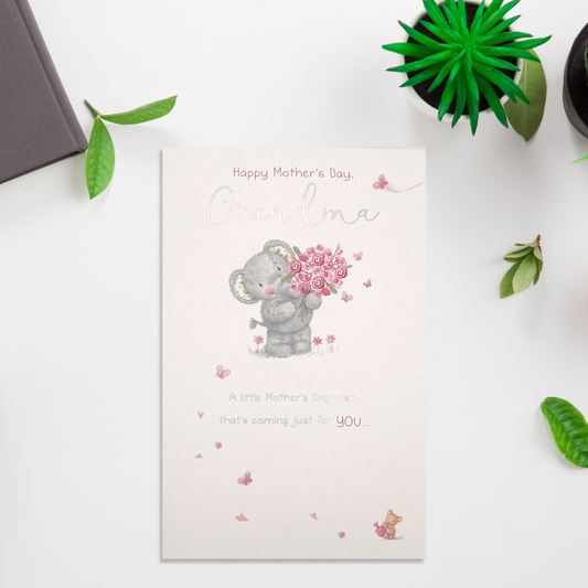 white card with grey elephant character with pink roses