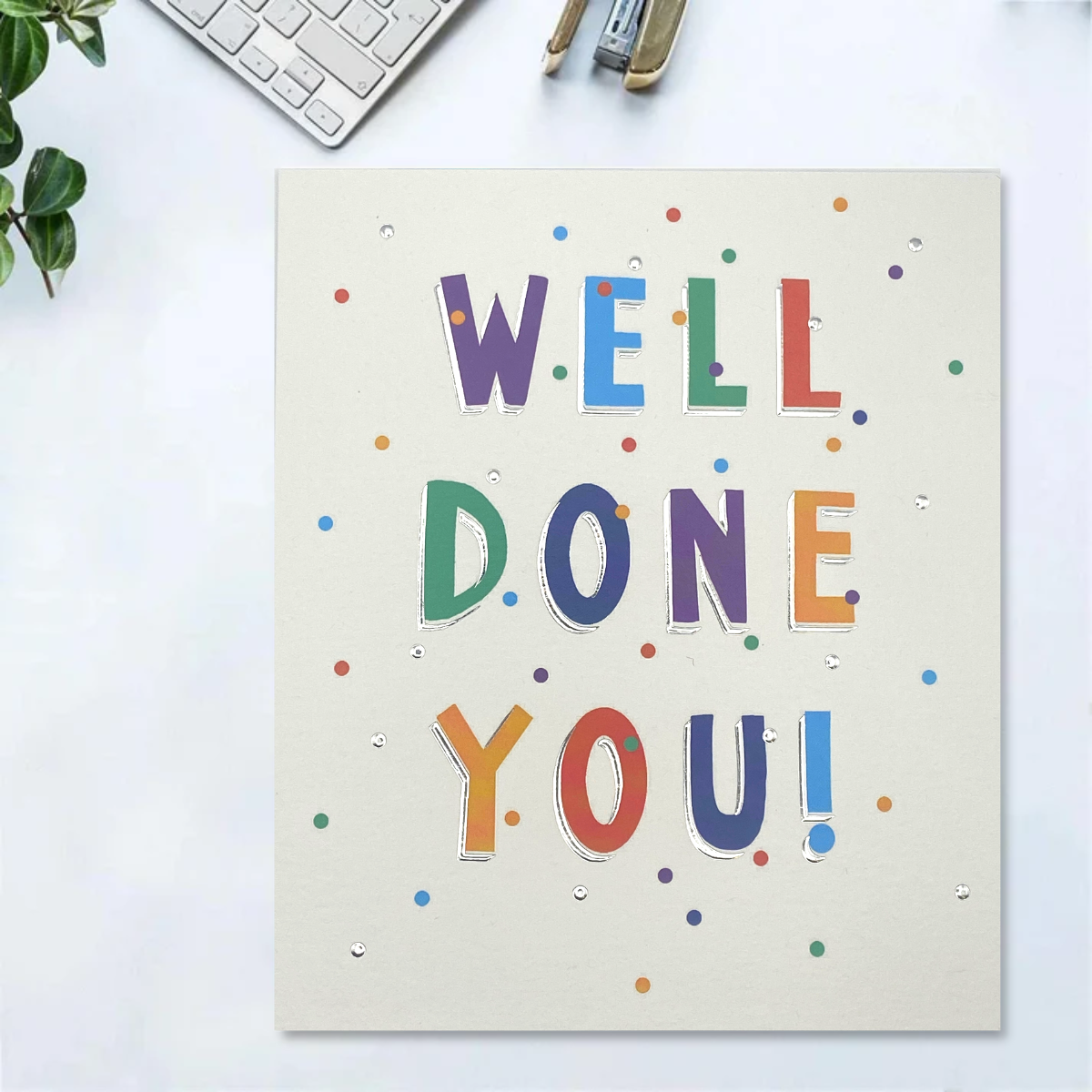 White card with multicolour text saying well done you