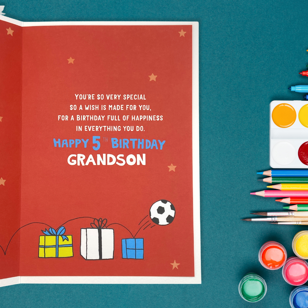 inside image with red printed insert with football bouncing on gifts and printed verse