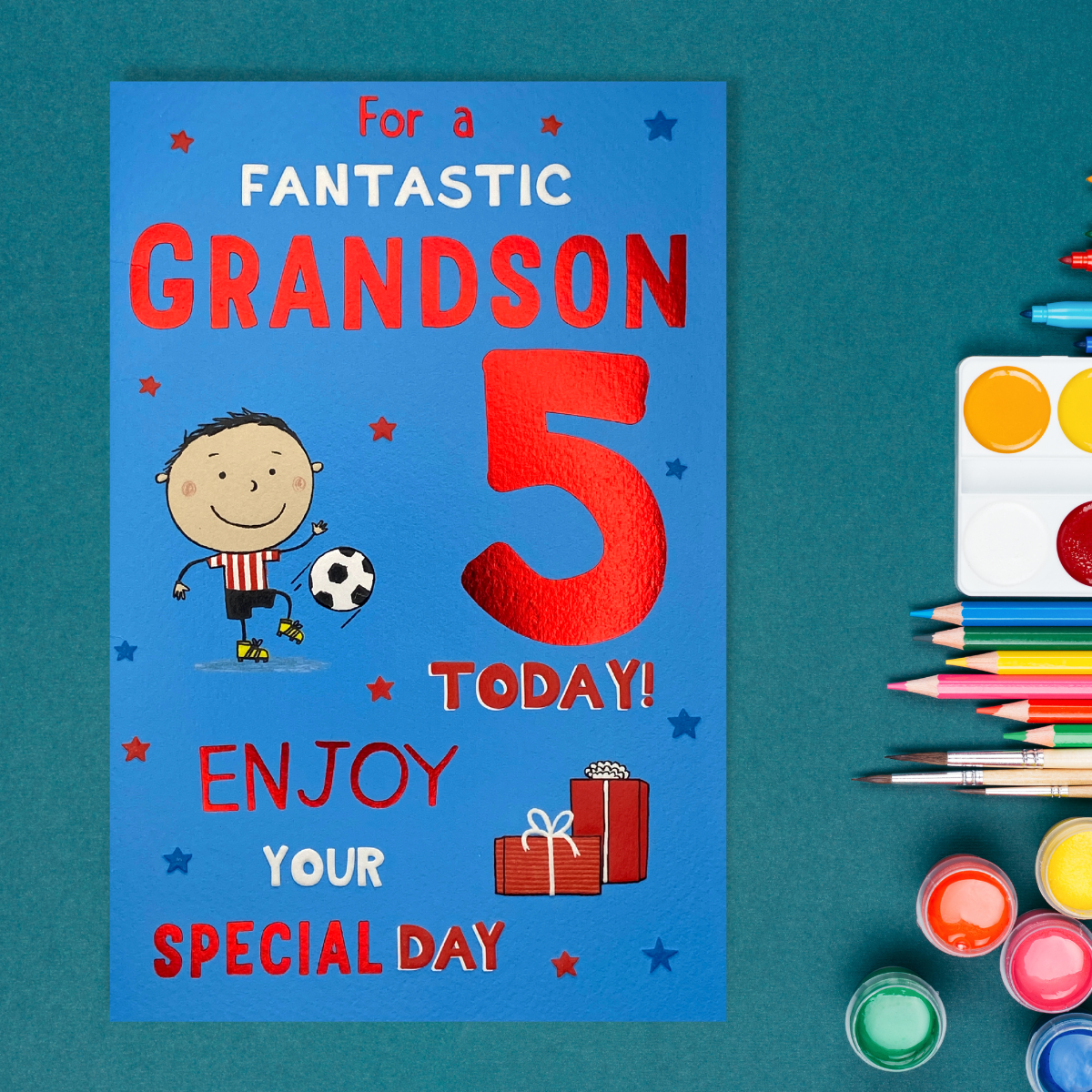 Front card image showing cartoon footballer and gifts with red foil text
