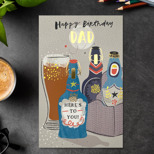 Front Image of Dad 3 fold card with beer bottles and glass with gold foil details