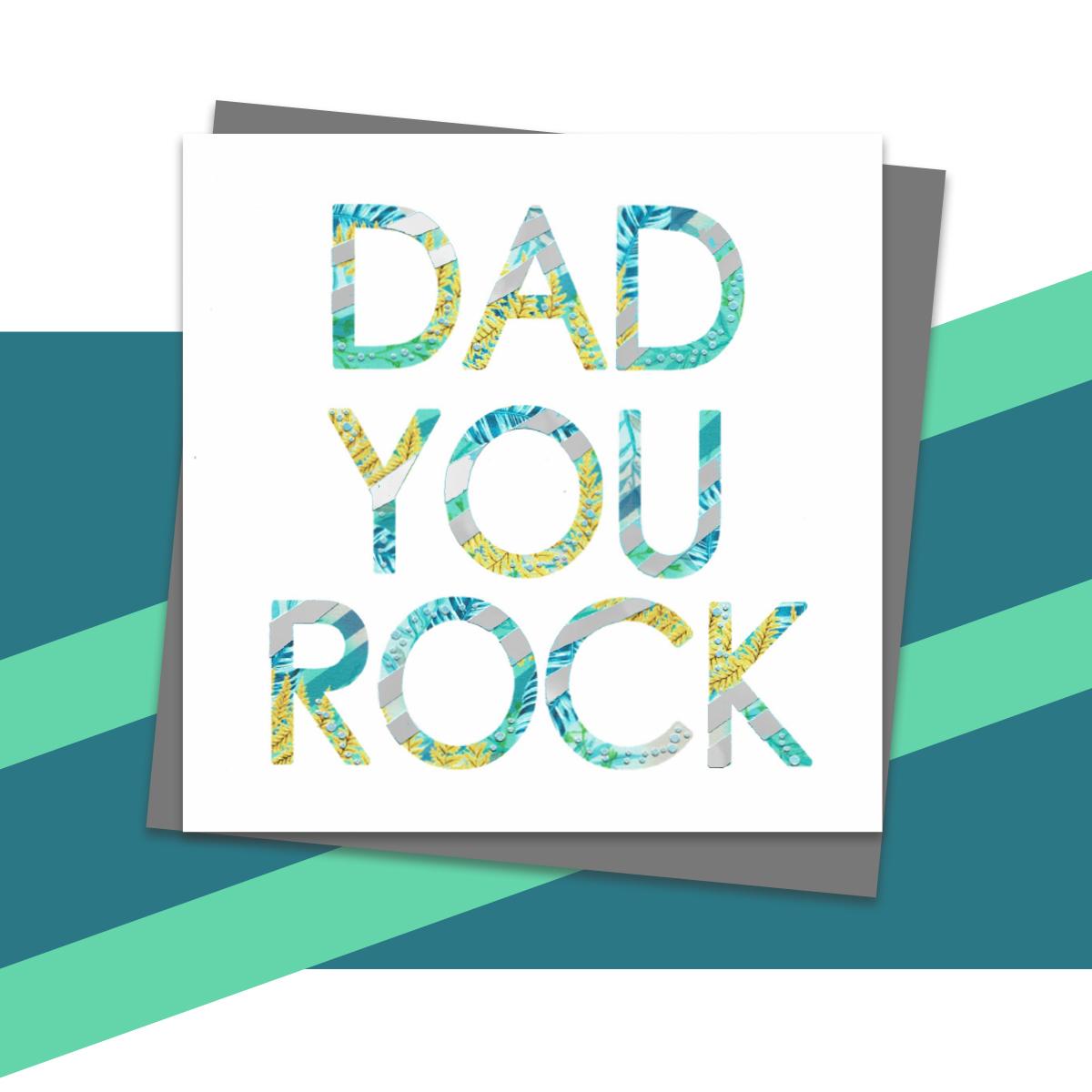 Dad You Rock Greeting Card Alongside Its Dark Grey Envelope