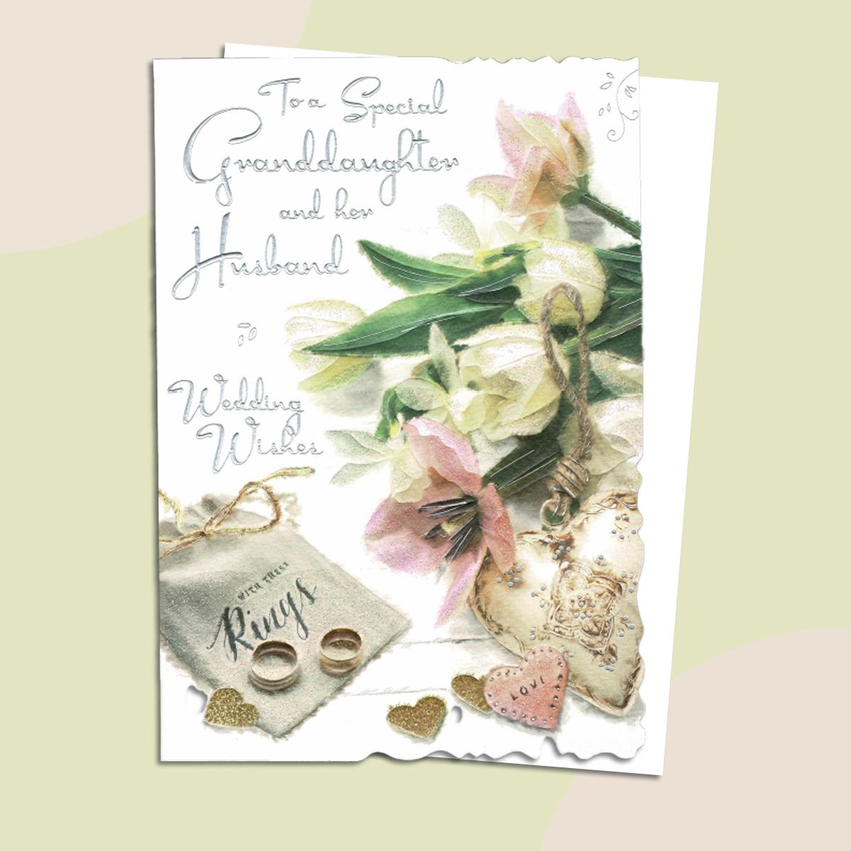Granddaughter And Husband Wedding Card Alongside Its White Envelope
