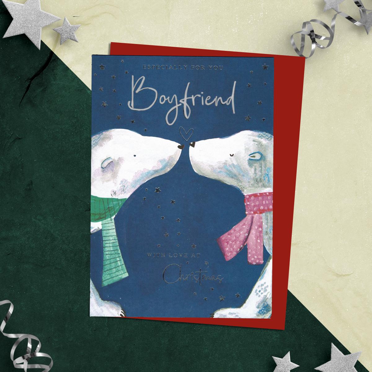 Especially For You Boyfriend With Love At Christmas Featuring A Blue Background With two Polar Bears Nose to Nose! Finished With Silver Foil Detailing, Sparkle, Red Envelope And Printed Insert