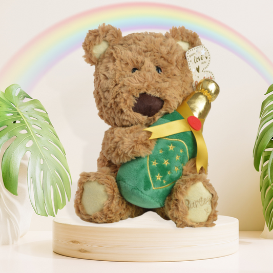 Barley Bear Plush Holding A Champagne Bottle Displayed In Full