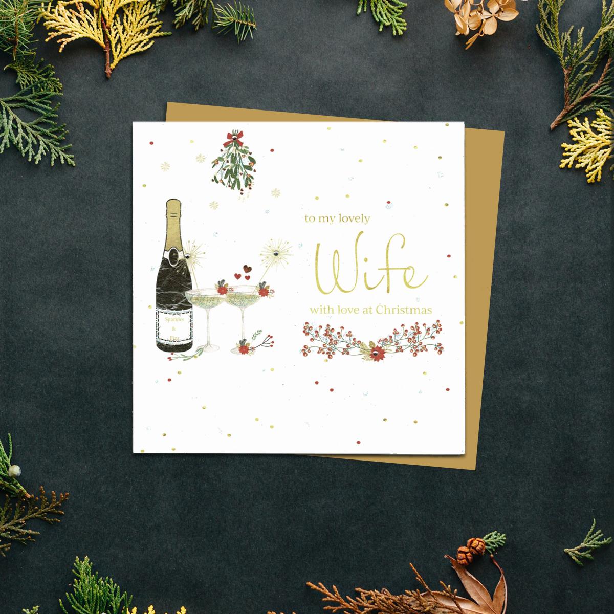 Wife Christmas Card Alongside Its Gold Envelope