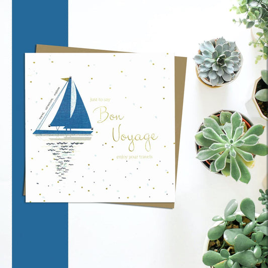 Bon Voyage Greeting Card Alongside Its Kraft Envelope