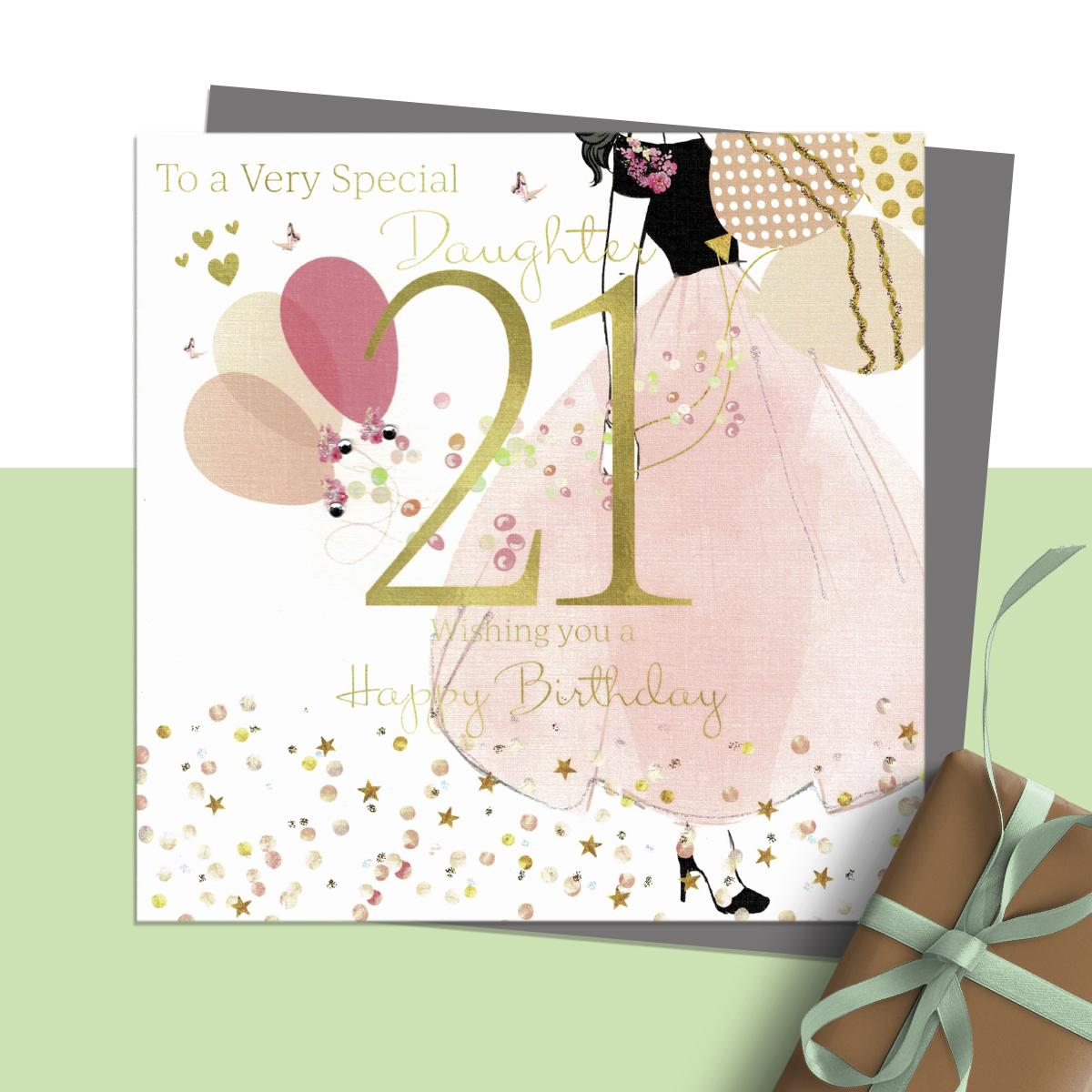 To A Very Special Daughter 21 Wishing You A Happy Birthday ' Featuring A Girl in A Large Skirted Dress And Balloons. Hand Finished With Sparkle And Jewel Embellishments. Blank Inside For Own Message. Complete With Silver Coloured Envelope
