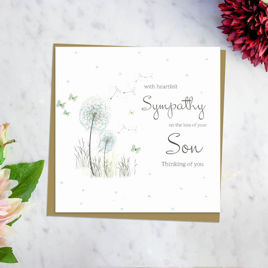 With Heartfelt Sympathy On The Loss Of Your Son Thinking Of You' Card Featuring A Dandelion Blowing In The Wind With Surrounding Butterflies. Complete With Brown Envelope And Blank Inside for Own Message
