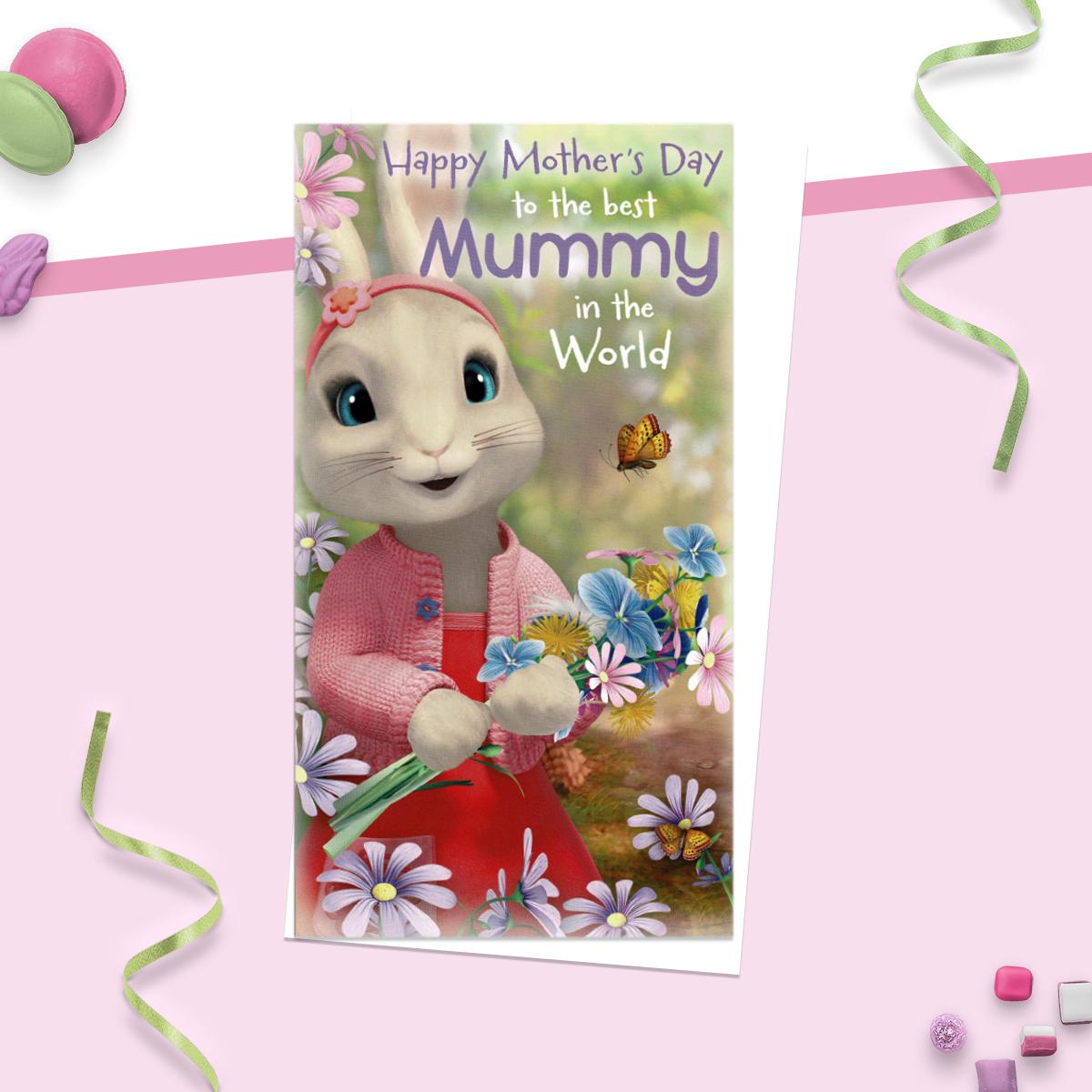 Mother's Day to the best Mummy in the world ' card showing Peter Rabbit holding a bunch of flowers. Complete With White Evelope